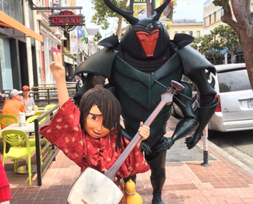Kubo and the two strings costume characters on the street